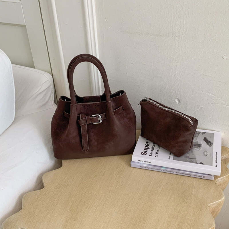 Ženska bucket torba s ručnim nošenjem i crossbody remenom, minimalistički dizajn, korejski stil 2026, visokokvalitetna, svakodnevna torba