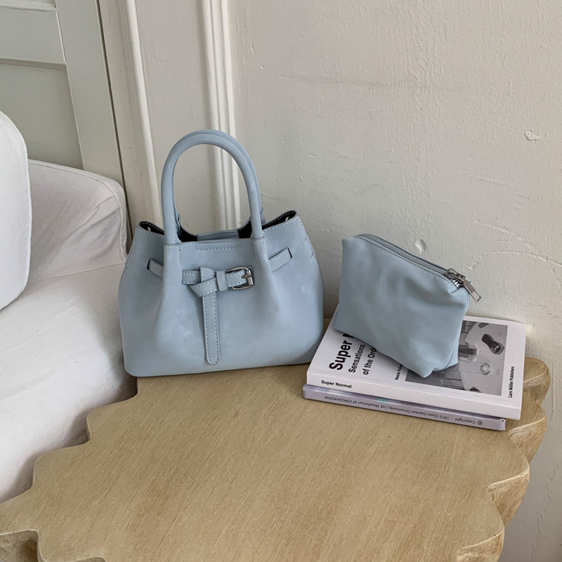 Ženska bucket torba s ručnim nošenjem i crossbody remenom, minimalistički dizajn, korejski stil 2026, visokokvalitetna, svakodnevna torba