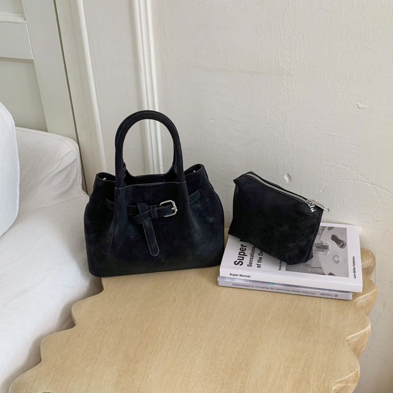 Ženska bucket torba s ručnim nošenjem i crossbody remenom, minimalistički dizajn, korejski stil 2026, visokokvalitetna, svakodnevna torba