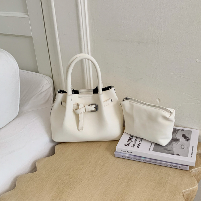 Ženska bucket torba s ručnim nošenjem i crossbody remenom, minimalistički dizajn, korejski stil 2026, visokokvalitetna, svakodnevna torba