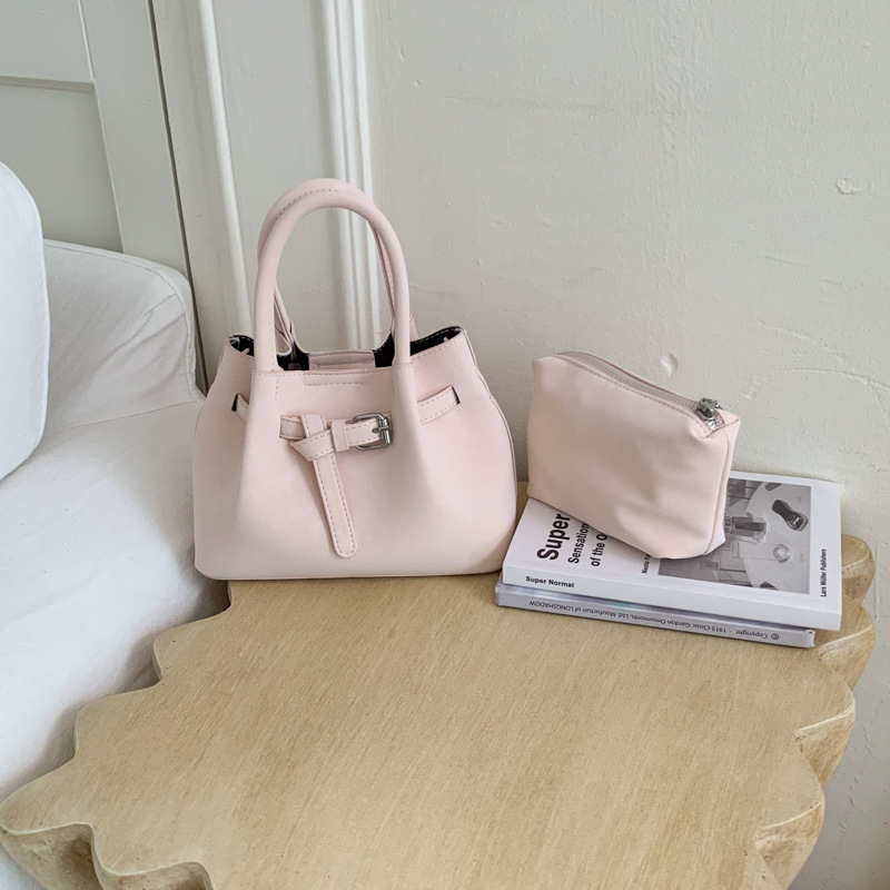 Ženska bucket torba s ručnim nošenjem i crossbody remenom, minimalistički dizajn, korejski stil 2026, visokokvalitetna, svakodnevna torba