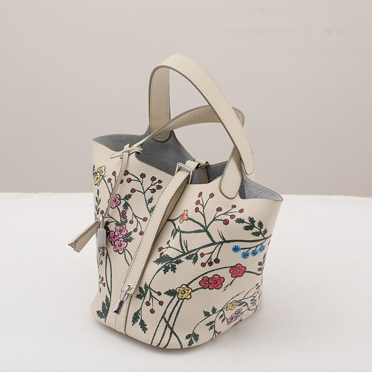 Ženska bucket torba s floralnim printom od prave kože od prvog sloja goveđe kože