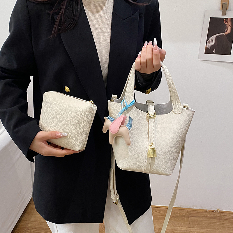 Lujia ženska bucket torba s lychee teksturom, PU koža, mala veličina, jednobojna, naramenica crossbody, proljeće 2026