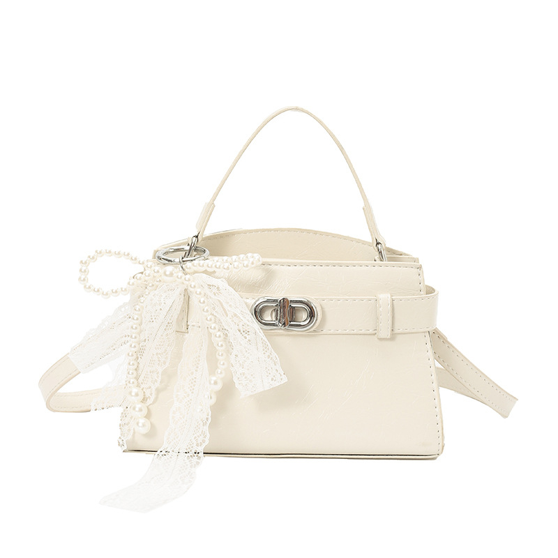 Ženska Kelly torbica s nišnim dizajnom, lagani luksuz, novi model 2026, visoka kvaliteta, pogodna za rame ili crossbody.