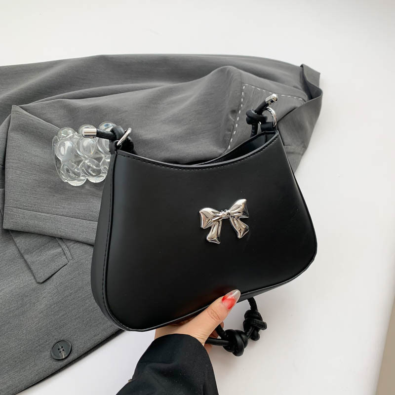 Ženska torbica s mašnicom u obliku polumjeseca, preko ramena i crossbody, dojam vrhunske kvalitete, nišni model