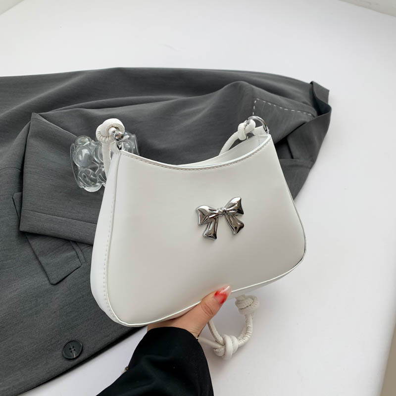 Ženska torbica s mašnicom u obliku polumjeseca, preko ramena i crossbody, dojam vrhunske kvalitete, nišni model
