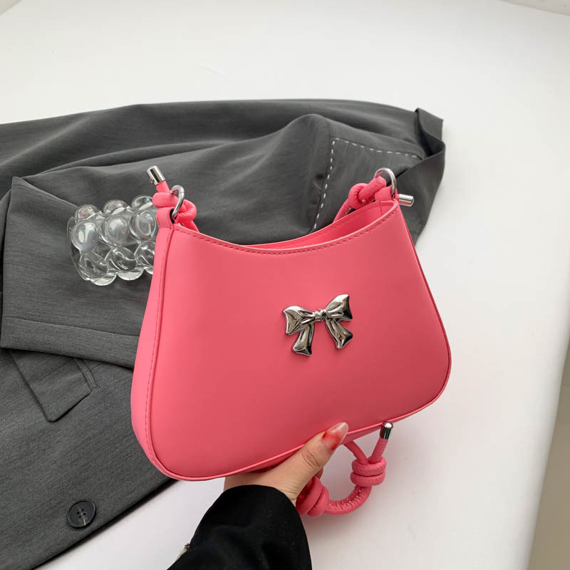 Ženska torbica s mašnicom u obliku polumjeseca, preko ramena i crossbody, dojam vrhunske kvalitete, nišni model