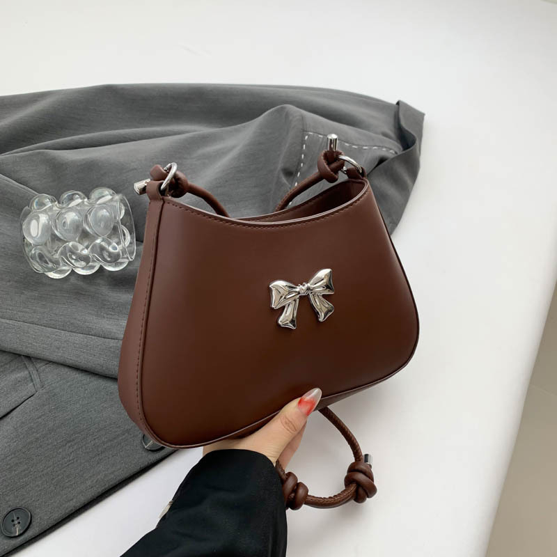 Ženska torbica s mašnicom u obliku polumjeseca, preko ramena i crossbody, dojam vrhunske kvalitete, nišni model