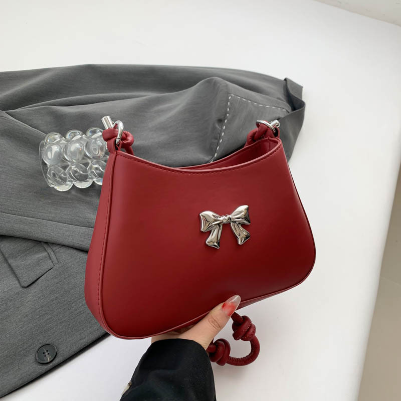 Ženska torbica s mašnicom u obliku polumjeseca, preko ramena i crossbody, dojam vrhunske kvalitete, nišni model