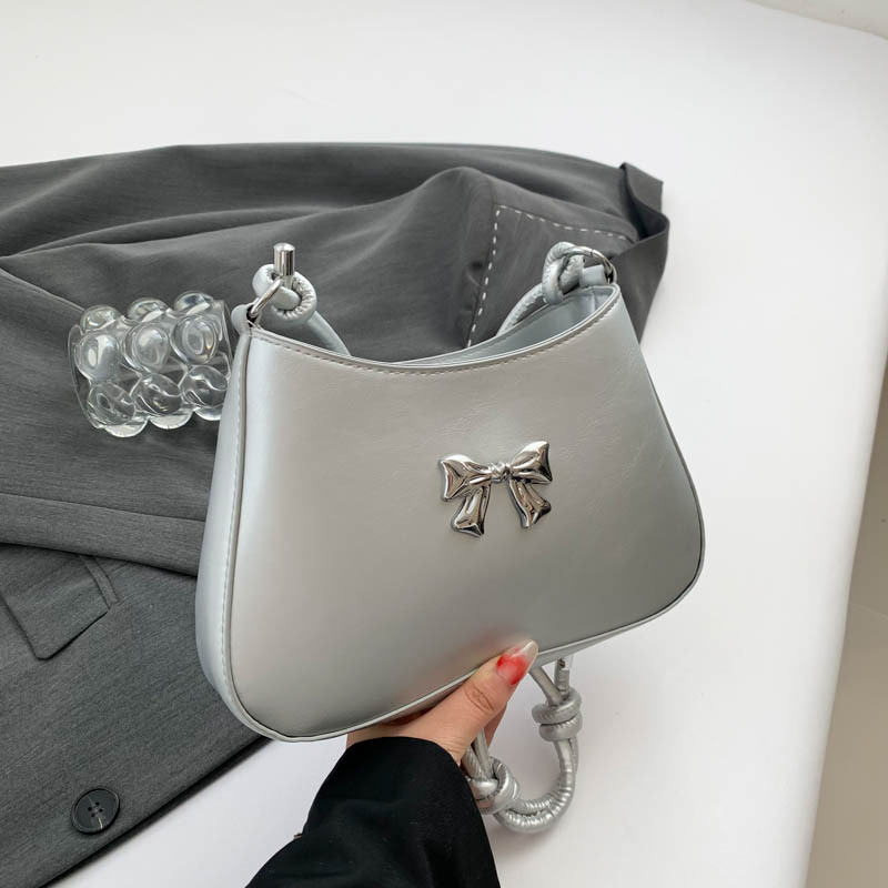 Ženska torbica s mašnicom u obliku polumjeseca, preko ramena i crossbody, dojam vrhunske kvalitete, nišni model