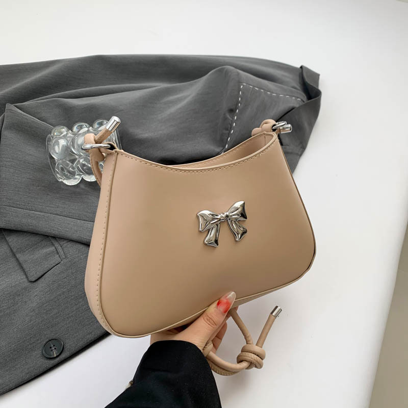 Ženska torbica s mašnicom u obliku polumjeseca, preko ramena i crossbody, dojam vrhunske kvalitete, nišni model
