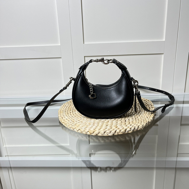 Ženska mini torbica s retro polumjesecom, crossbody, od prave kože.
