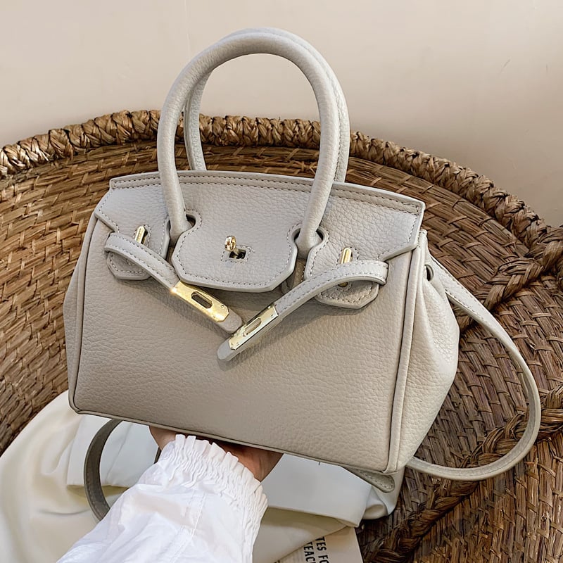 Ženska torbica od PU kože, može se nositi preko ramena ili kao crossbody, srednje veličine, platinski završetak, gradski minimalistički stil, 2025