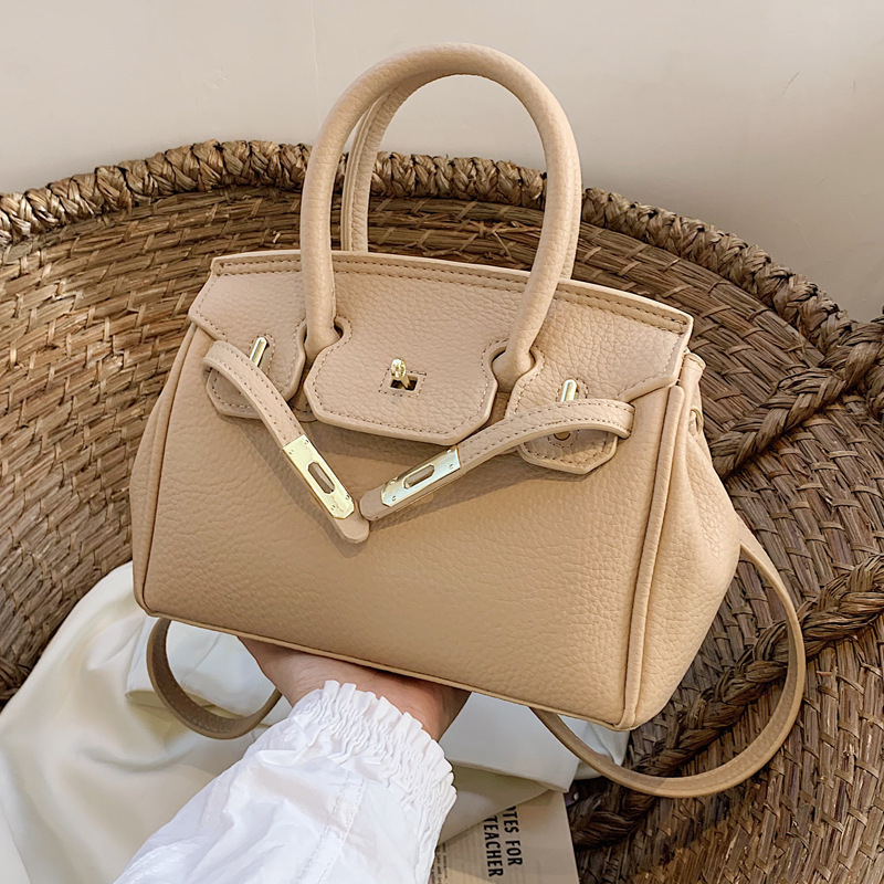 Ženska torbica od PU kože, može se nositi preko ramena ili kao crossbody, srednje veličine, platinski završetak, gradski minimalistički stil, 2025