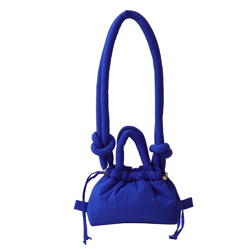 Ženska bucket bag u bombon boji, mala nylon torba sa šnrom za nošenje preko ramena