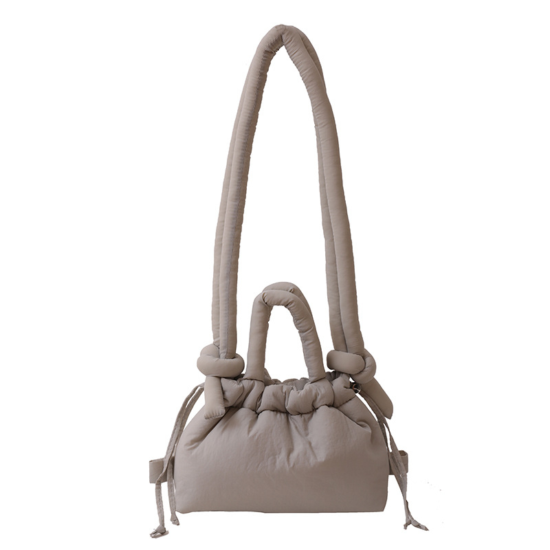 Ženska bucket bag u bombon boji, mala nylon torba sa šnrom za nošenje preko ramena
