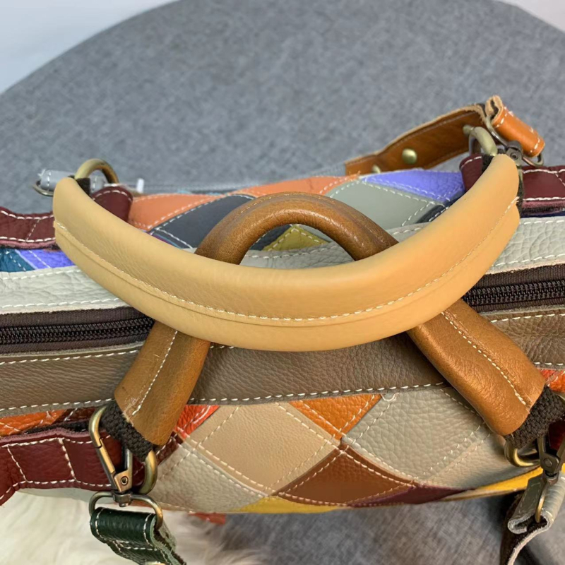 Ženska torba od prave kože, bucket stil, color-block dizajn i metalne niti, na ramenu
