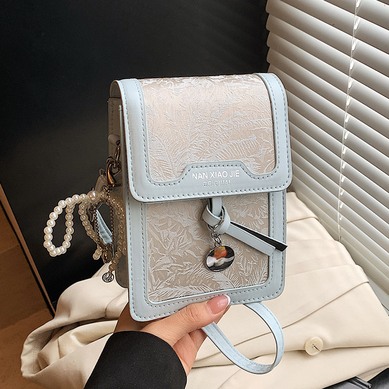 Ženska PU mala kvadratna crossbody torbica — minimalistički i luksuzan stil, s pretincem za telefon, ljeto 2025