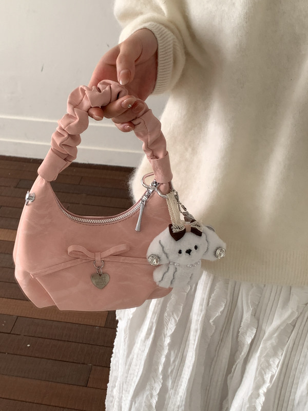 Ženska mini plisirana torbica s mašnicom i lancem, crossbody preko ramena — proljeće 2026