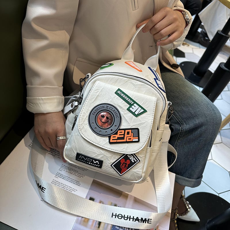 Stilizirani ruksak s retro japansko-korejskim Harajuku stilom, vrhunski plisirani dizajn značke, meka ženska torba od PU materijala
