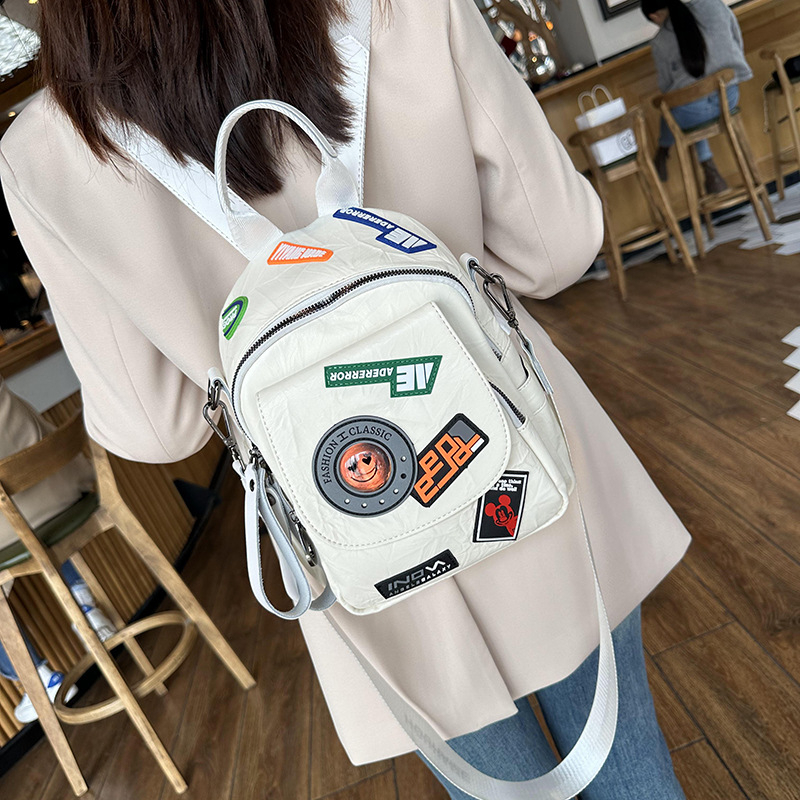 Stilizirani ruksak s retro japansko-korejskim Harajuku stilom, vrhunski plisirani dizajn značke, meka ženska torba od PU materijala