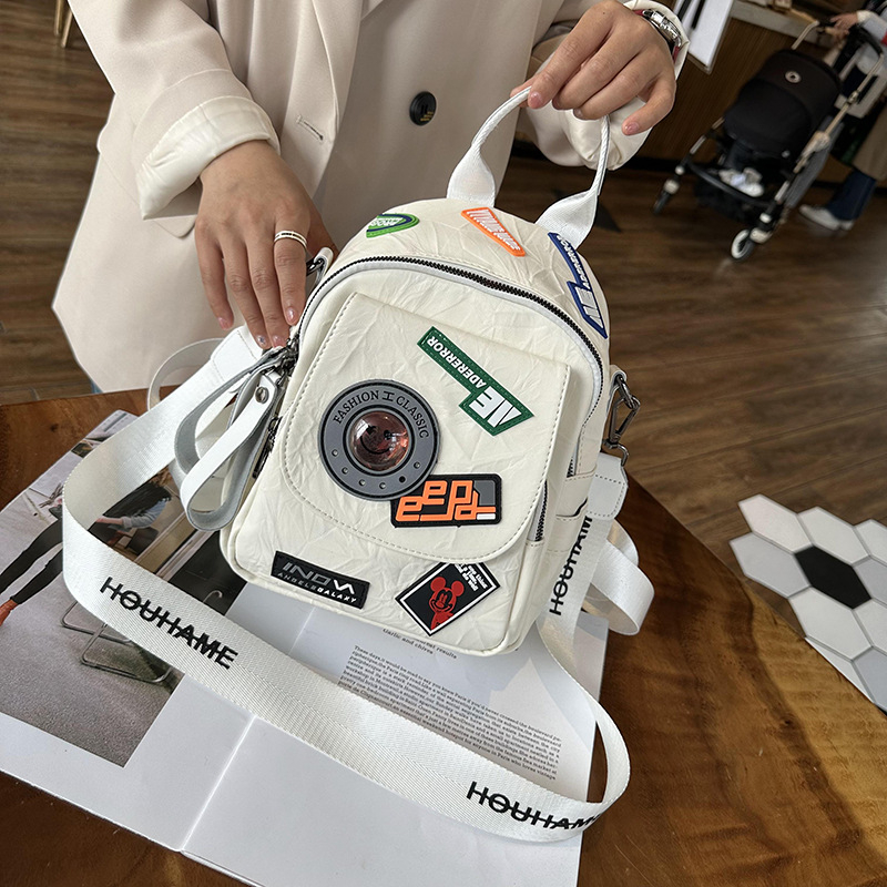 Stilizirani ruksak s retro japansko-korejskim Harajuku stilom, vrhunski plisirani dizajn značke, meka ženska torba od PU materijala