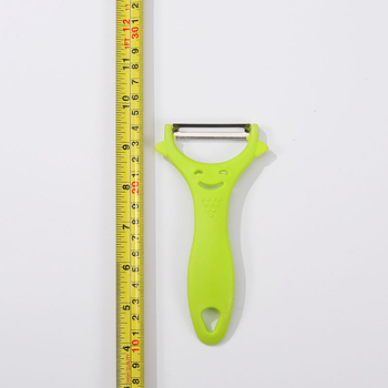 Peeler din oțel inoxidabil, mâner din plastic, cu față zâmbitoare – pentru fructe și legume