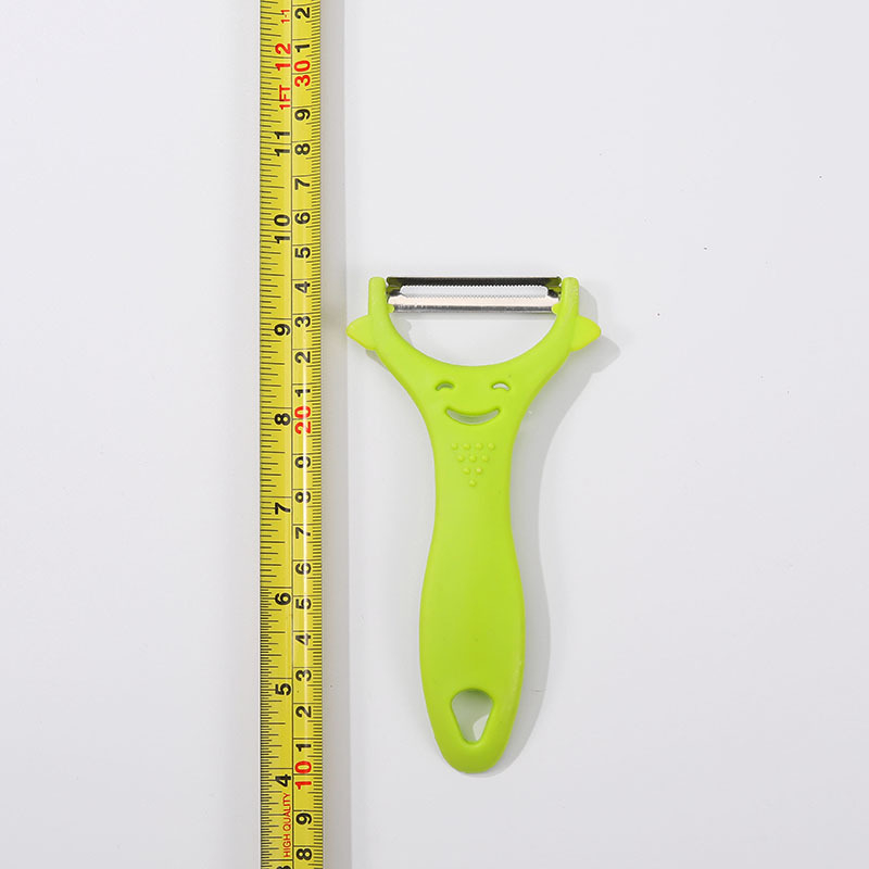 Peeler din oțel inoxidabil, mâner din plastic, cu față zâmbitoare – pentru fructe și legume