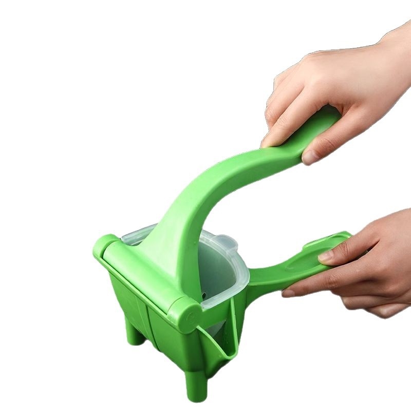 Extractor de suc manual pentru fructe, compact și portabil