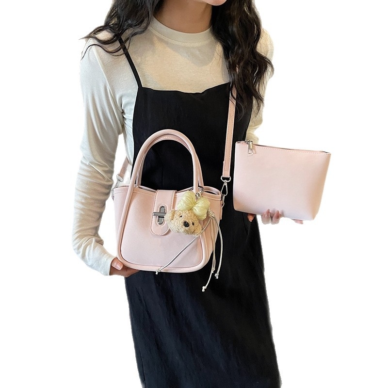 Minimalistička ženska torba na rame s crossbody remenom, 2026 nova moda, kompaktna torba u obliku kante s dizajnom inspiriranim krilima