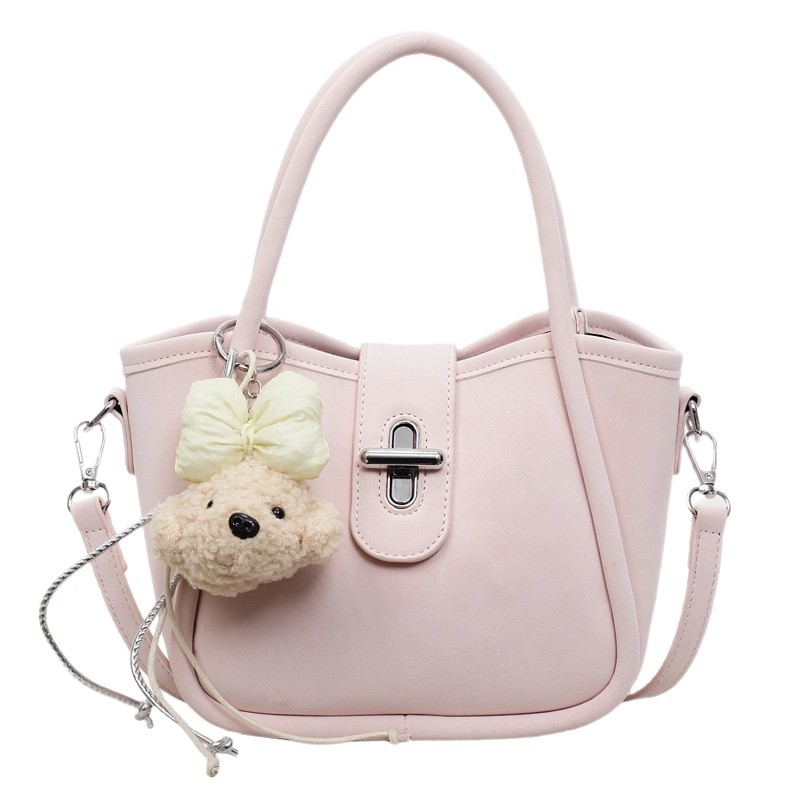 Minimalistička ženska torba na rame s crossbody remenom, 2026 nova moda, kompaktna torba u obliku kante s dizajnom inspiriranim krilima