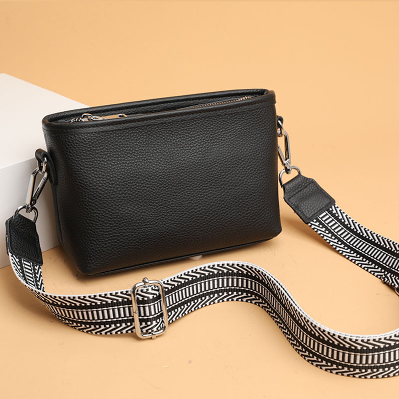 Női valódi bőr bucket táska széles vállpánttal, minimalista crossbody, 2025-ös új modell.