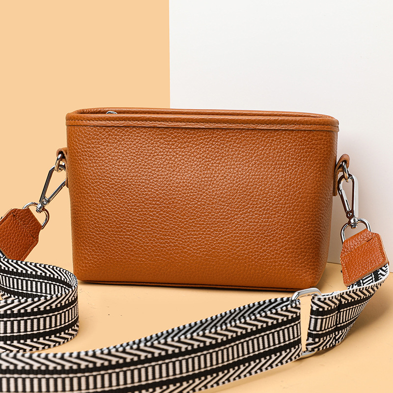 Női valódi bőr bucket táska széles vállpánttal, minimalista crossbody, 2025-ös új modell.
