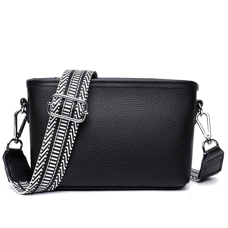 Női valódi bőr bucket táska széles vállpánttal, minimalista crossbody, 2025-ös új modell.