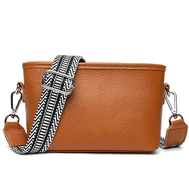 Női valódi bőr bucket táska széles vállpánttal, minimalista crossbody, 2025-ös új modell.