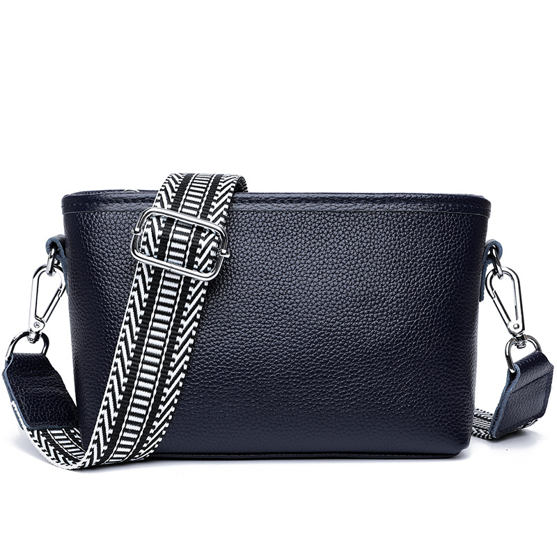 Női valódi bőr bucket táska széles vállpánttal, minimalista crossbody, 2025-ös új modell.