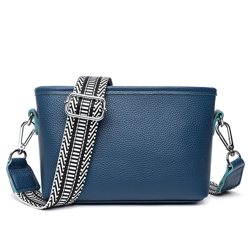 Női valódi bőr bucket táska széles vállpánttal, minimalista crossbody, 2025-ös új modell.