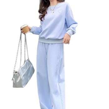 Ženski dvodijelni sportski set: dugi rukav sweatshirt i široke hlače, ležerni kroj, poliester.