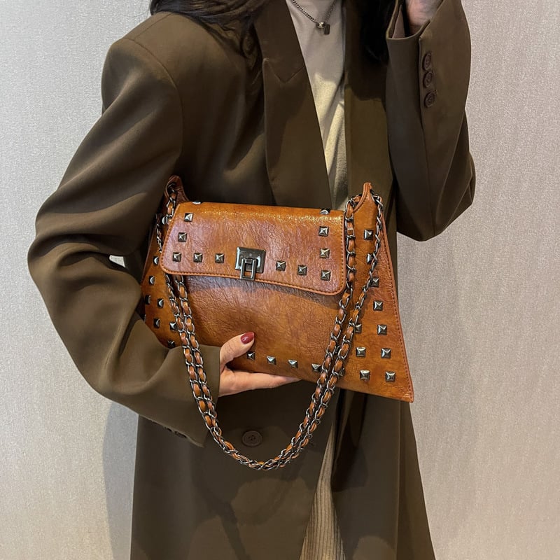 Vintage ženska torbica tipa kofer s nitima i lančanim remenom za rame, teksturirana crossbody