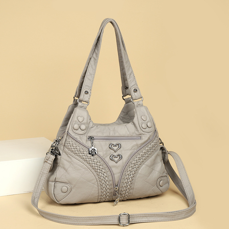 Ženska torba s metalnim rivetima, velika prostornost, PU koža, ramena i crossbody, 2025 novi model