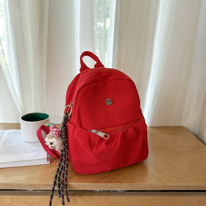 2025 novi mini ruksak za unisex, jednobojan, lagan, velika kapaciteta, školska torba za 10-inčni prijenosnik