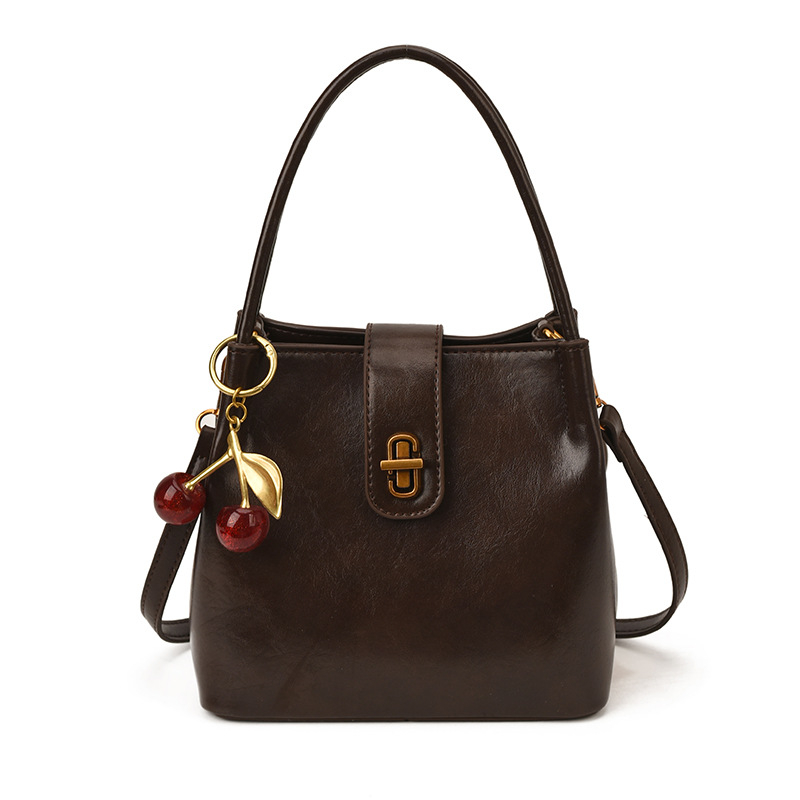 Ženska bucket torba u stilu light luxury, s retro teksturom, jednostavan dizajn, svestrana za rameni ili crossbody, 26 novih modela, proljeće 2026