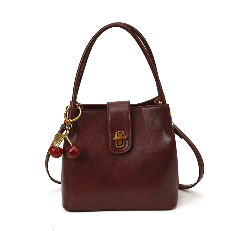 Ženska bucket torba u stilu light luxury, s retro teksturom, jednostavan dizajn, svestrana za rameni ili crossbody, 26 novih modela, proljeće 2026