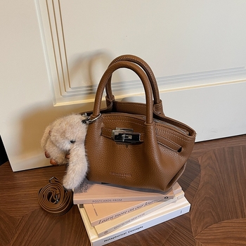 Női koreai stílusú bucket táska öv díszítéssel, 2026 téli modell, váll- és crossbody kivitel