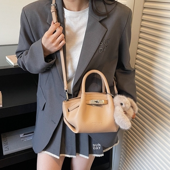 Női koreai stílusú bucket táska öv díszítéssel, 2026 téli modell, váll- és crossbody kivitel