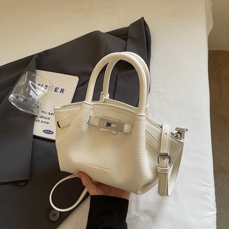 Női koreai stílusú bucket táska öv díszítéssel, 2026 téli modell, váll- és crossbody kivitel