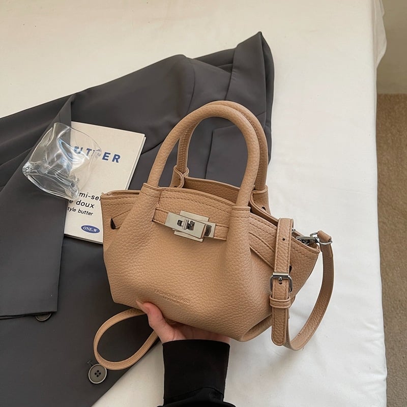 Női koreai stílusú bucket táska öv díszítéssel, 2026 téli modell, váll- és crossbody kivitel