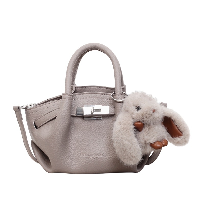 Női koreai stílusú bucket táska öv díszítéssel, 2026 téli modell, váll- és crossbody kivitel