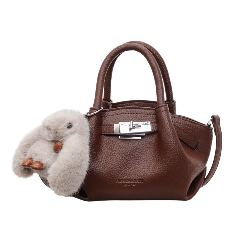 Női koreai stílusú bucket táska öv díszítéssel, 2026 téli modell, váll- és crossbody kivitel
