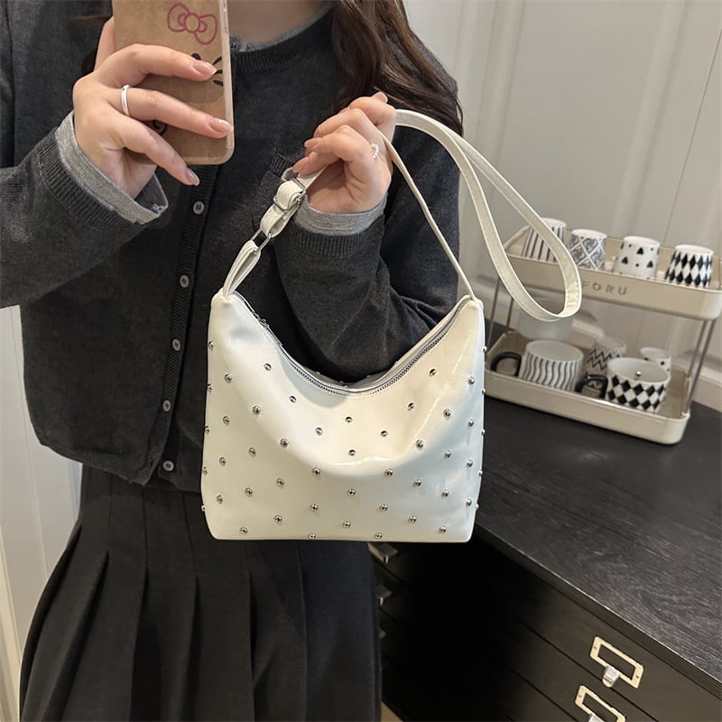 Torbica preko ramena s nitima – vintage tekstura, oblik knedle, crossbody, 2026